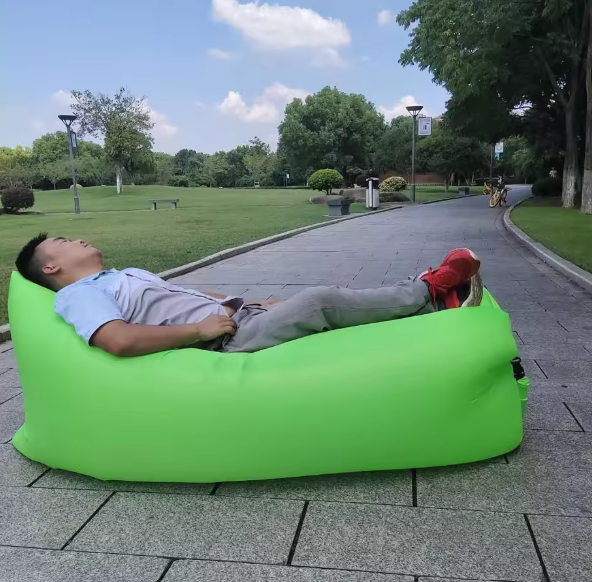 Portable Inflatable Air Lounger Sofa for Camping & Festivals. Lightweight Oxford cloth design, no pump needed, quick inflation, comfortable single-person outdoor bed for beach, park, travel, hiking, and relaxing anywhere